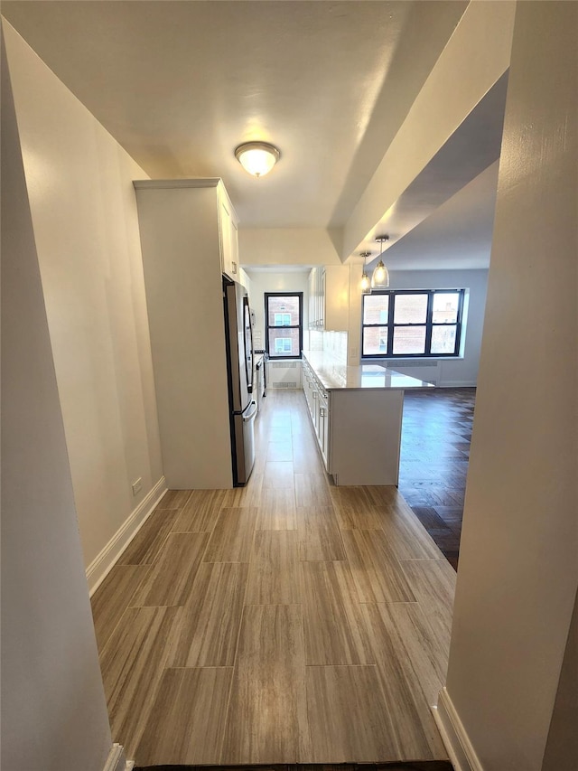 hallway featuring light wood-type flooring