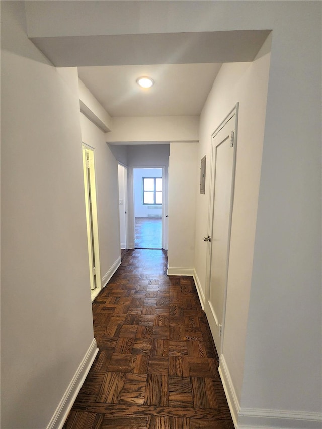 hallway featuring dark parquet floors