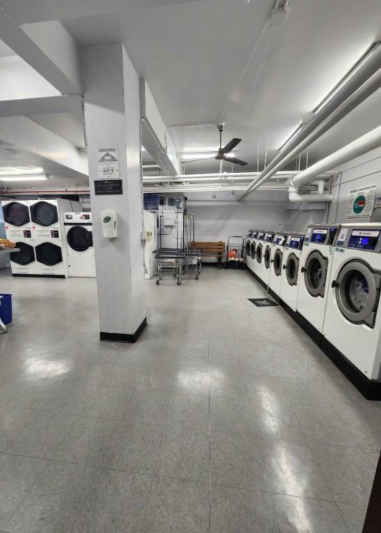 laundry area featuring stacked washer / dryer and washing machine and dryer