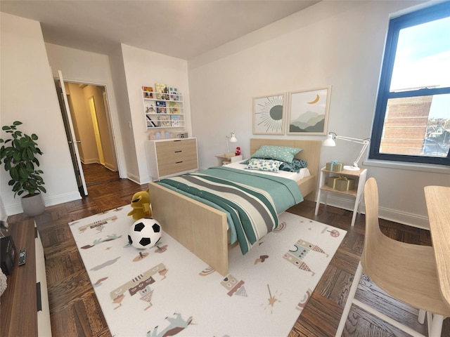 bedroom with dark parquet flooring