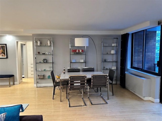 dining area with light hardwood / wood-style floors