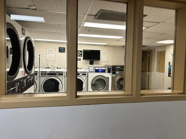 clothes washing area featuring washing machine and dryer