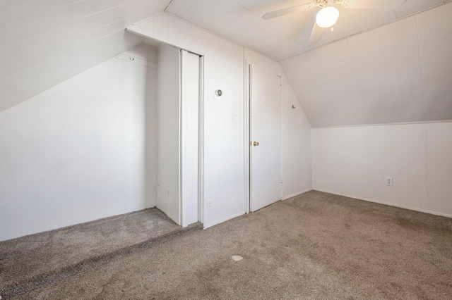 additional living space featuring vaulted ceiling, ceiling fan, and carpet floors