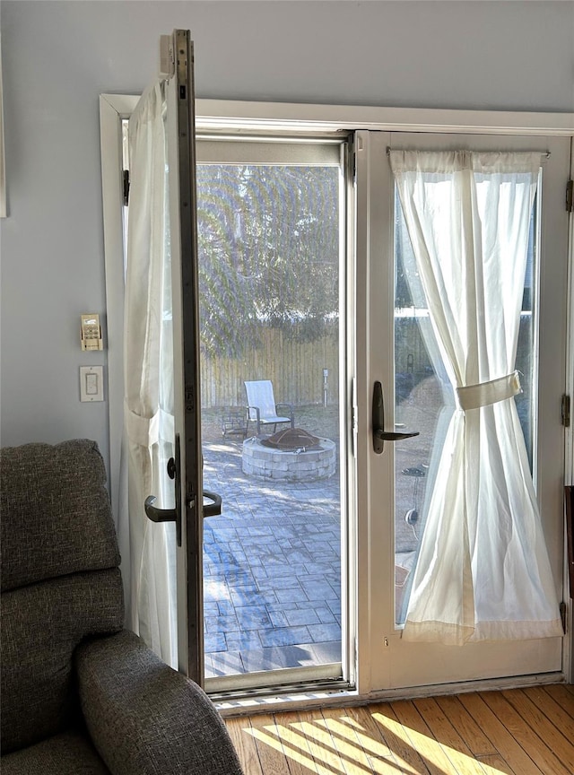 entryway with hardwood / wood-style floors