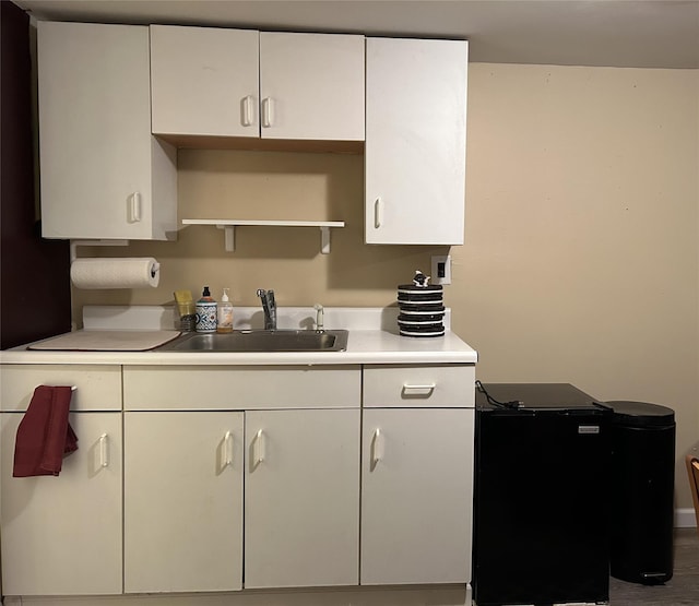 kitchen with sink and white cabinets