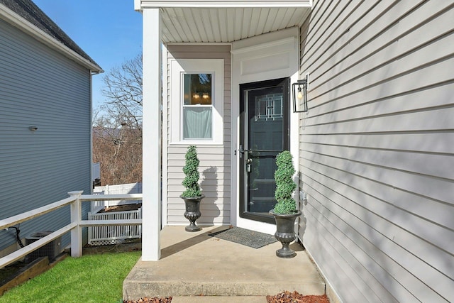 entrance to property featuring fence