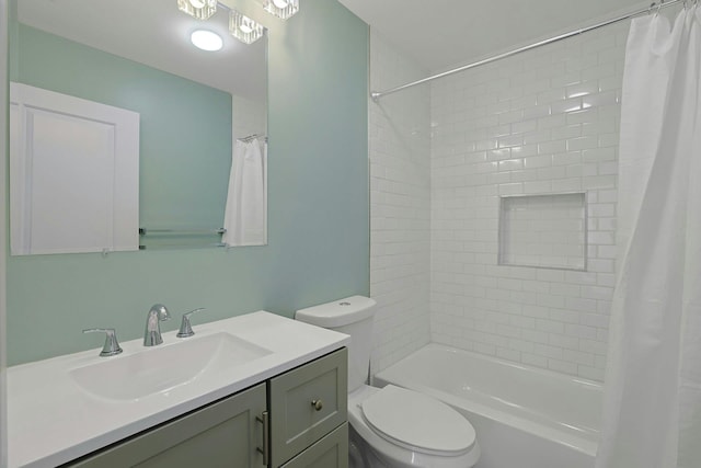 full bath with vanity, toilet, and shower / bath combo with shower curtain