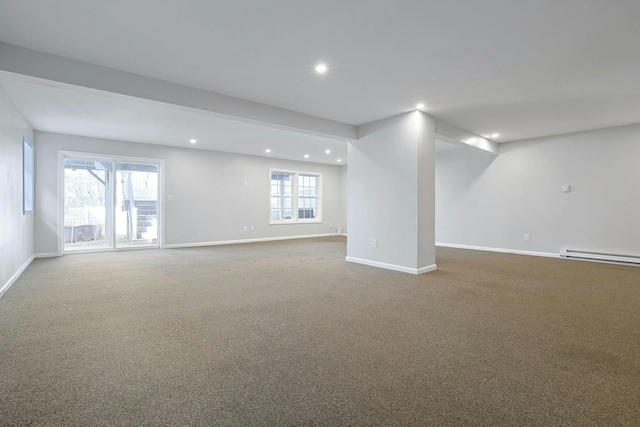 basement with carpet flooring, recessed lighting, a baseboard heating unit, and baseboards