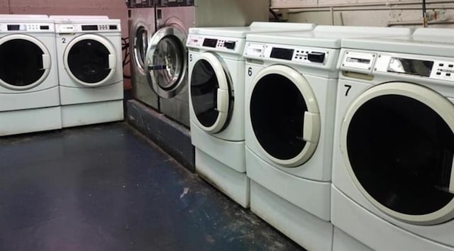 laundry area with independent washer and dryer