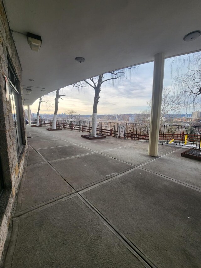 patio terrace at dusk featuring a playground