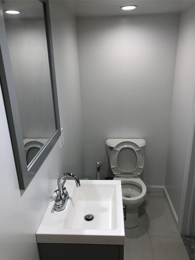 bathroom with vanity and toilet