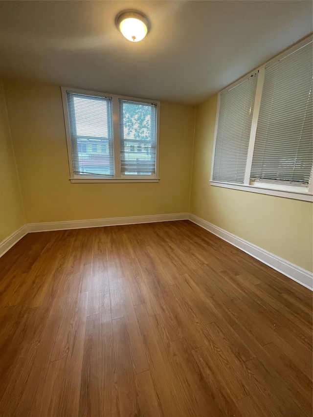 64-18 84th Pl, Middle Village, NY 11379 - unfurnished room featuring wood finished floors and baseboards