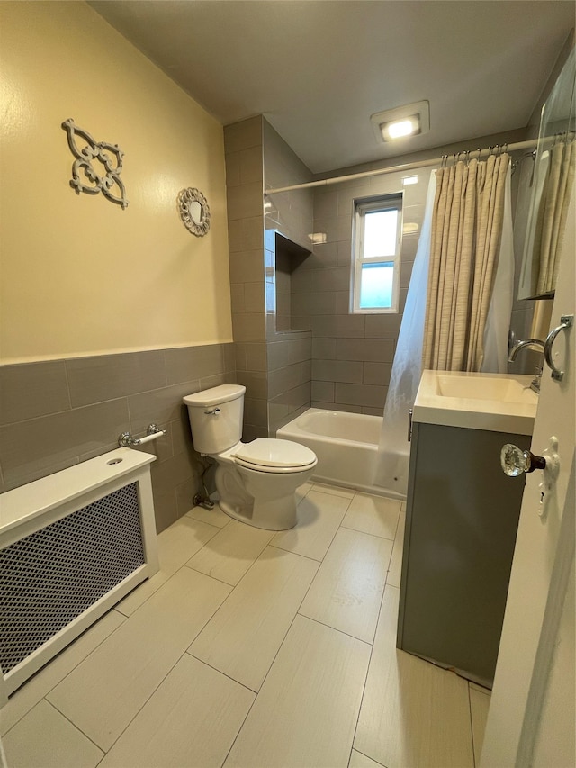 64-18 84th Pl, Middle Village, NY 11379 - bathroom featuring tile walls, toilet, shower / tub combo, vanity, and wainscoting