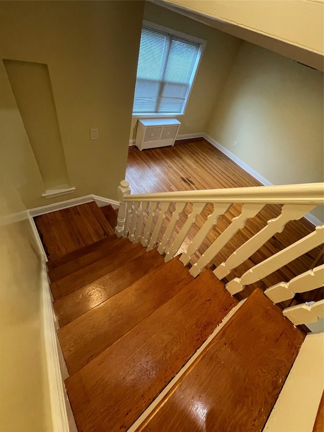 64-18 84th Pl, Middle Village, NY 11379 - stairs featuring wood finished floors and baseboards