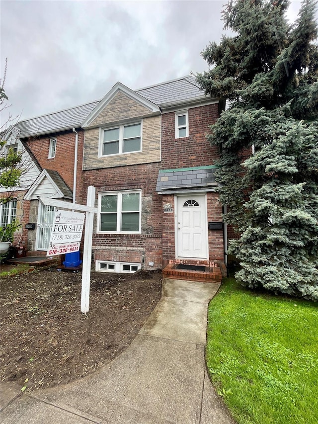 64-18 84th Pl, Middle Village, NY 11379 - view of front of property featuring brick siding and a high end roof