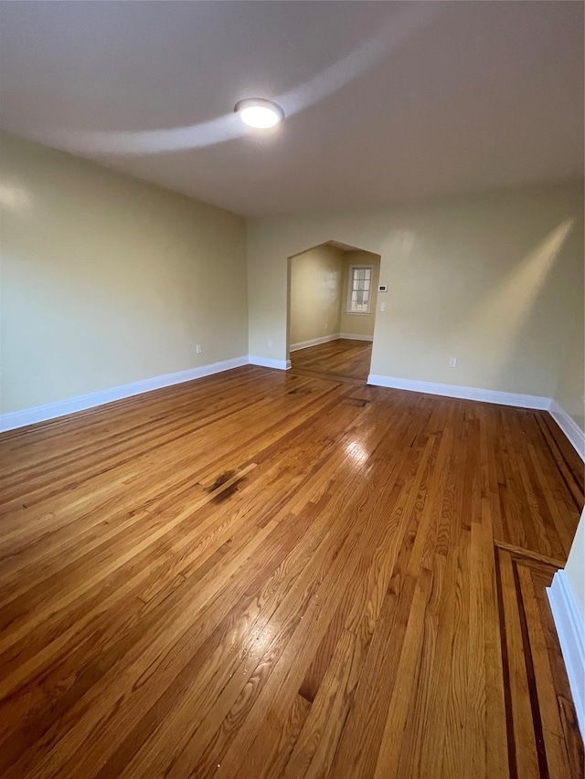 64-18 84th Pl, Middle Village, NY 11379 - unfurnished room featuring wood finished floors and baseboards