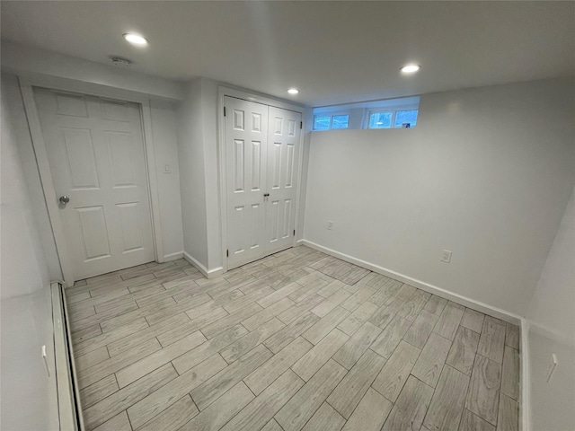 64-18 84th Pl, Middle Village, NY 11379 - below grade area with light wood finished floors, baseboards, and recessed lighting