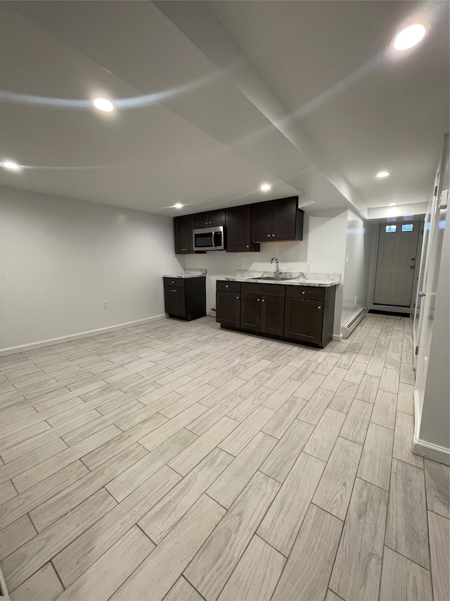 64-18 84th Pl, Middle Village, NY 11379 - kitchen with stainless steel microwave, baseboards, light wood-type flooring, dark brown cabinetry, and recessed lighting