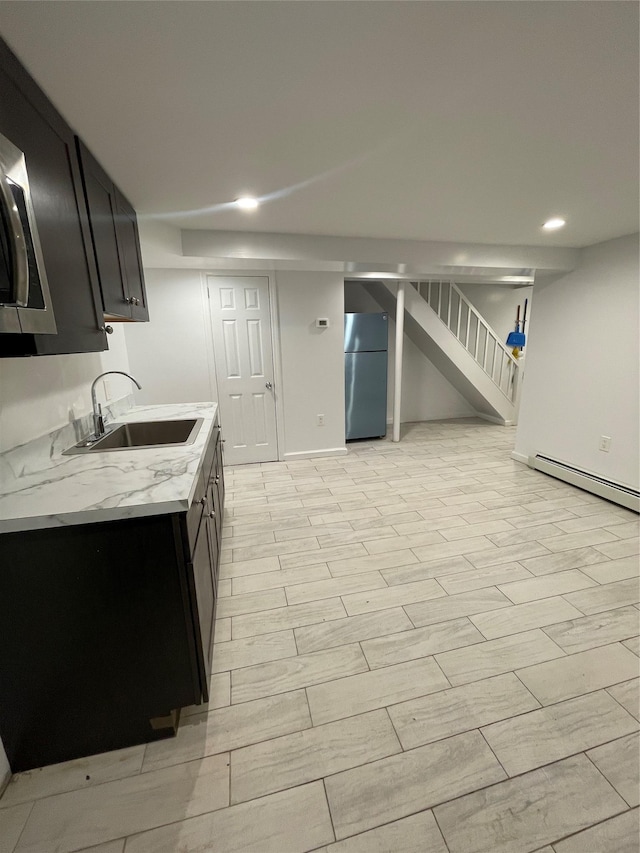 64-18 84th Pl, Middle Village, NY 11379 - kitchen with appliances with stainless steel finishes, a sink, recessed lighting, wood finish floors, and dark cabinets