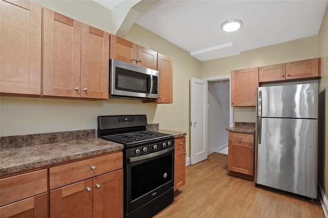 64-18 84th Pl, Middle Village, NY 11379 - kitchen featuring stainless steel appliances and light wood-style floors