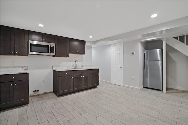 64-18 84th Pl, Middle Village, NY 11379 - kitchen with stainless steel appliances, dark brown cabinets, recessed lighting, and light wood-style flooring