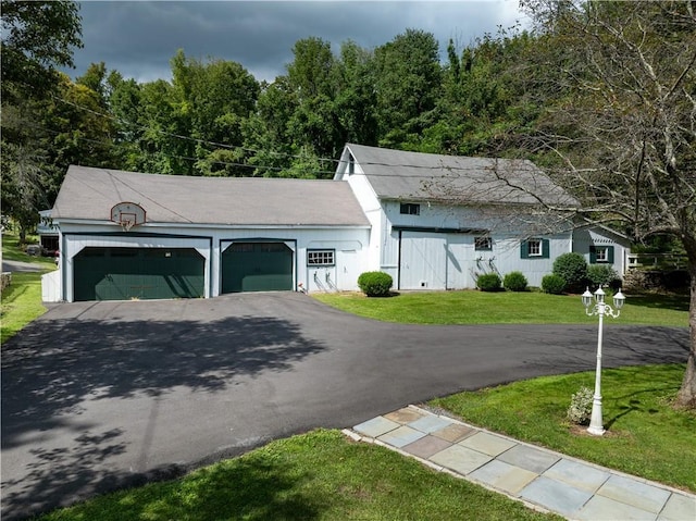 exterior space with a garage and a front yard