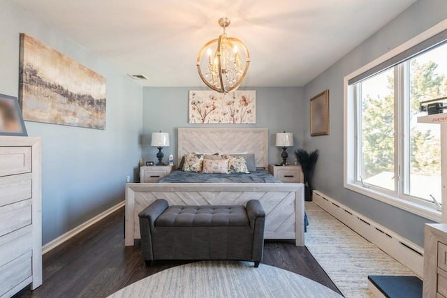 bedroom featuring multiple windows, dark wood-type flooring, and baseboard heating