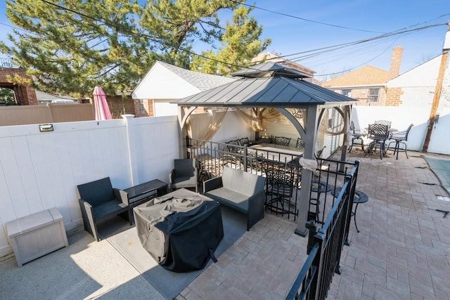 view of patio / terrace featuring a gazebo, a grill, outdoor lounge area, and an outdoor bar