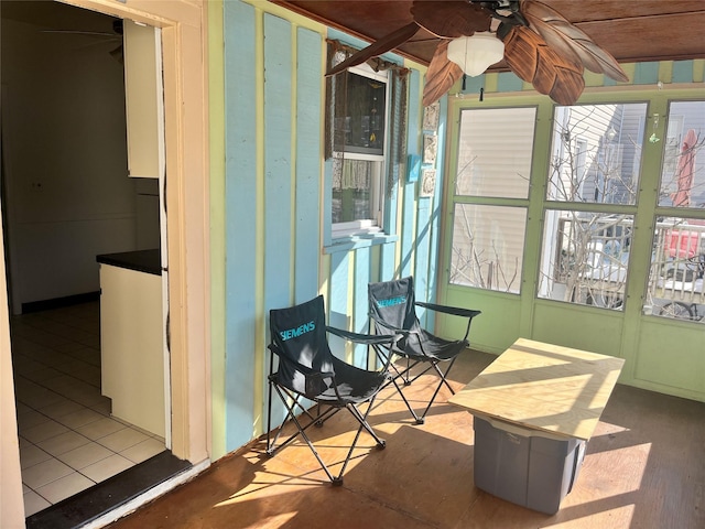 sunroom / solarium with ceiling fan