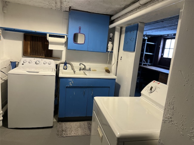 clothes washing area with sink and washing machine and clothes dryer