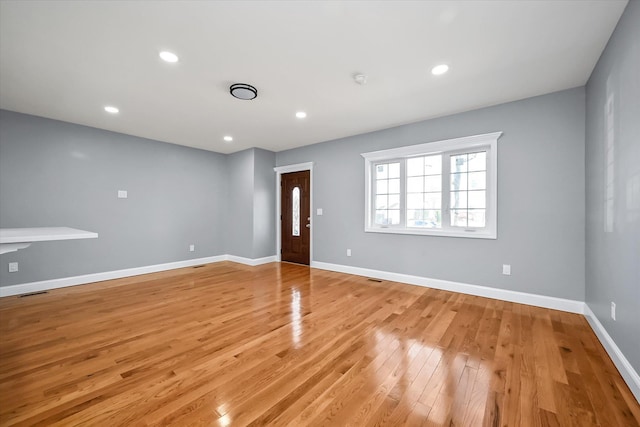 spare room with light hardwood / wood-style floors