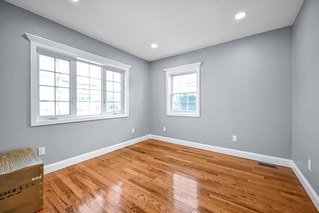 empty room featuring hardwood / wood-style floors