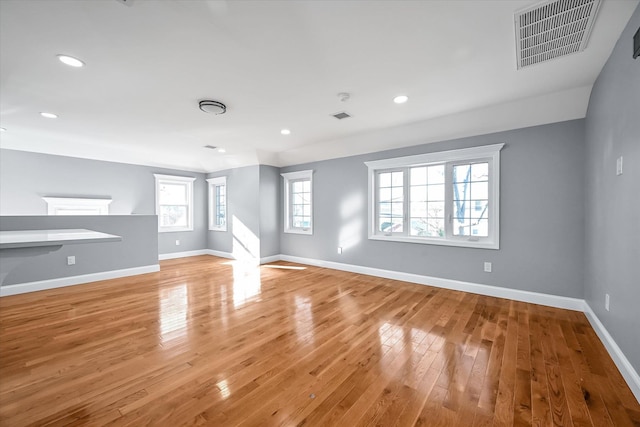 unfurnished living room with light wood-type flooring