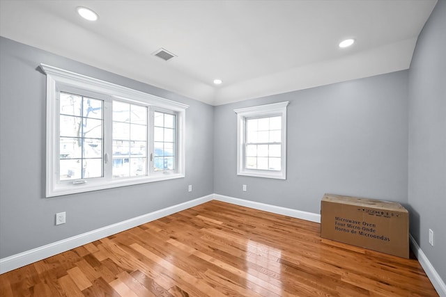 spare room featuring light wood-type flooring