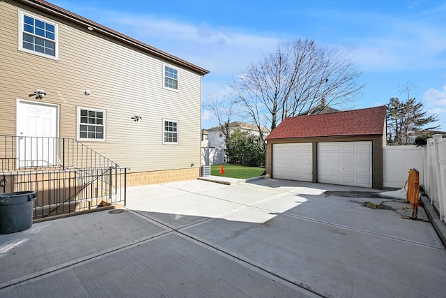 exterior space with an outbuilding and a garage