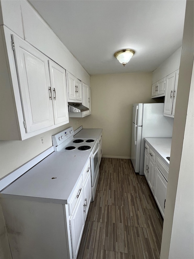 kitchen featuring dark hardwood / wood-style flooring, white cabinets, and white appliances