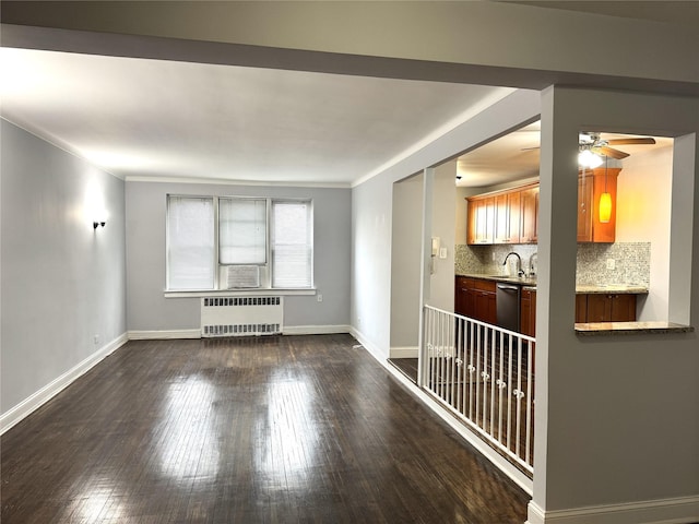 143-50 Hoover Ave Unit 204, Briarwood, NY 11435 - empty room with a sink, dark wood-style floors, radiator heating unit, baseboards, and ceiling fan
