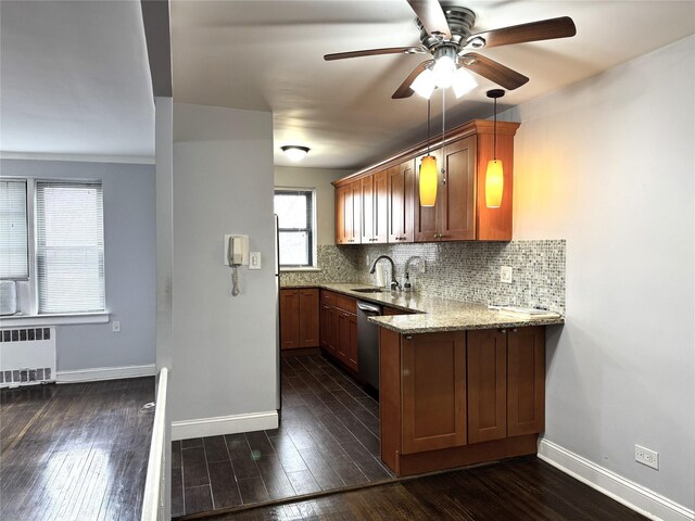 143-50 Hoover Ave Unit 204, Briarwood, NY 11435 - kitchen with light stone counters, dark wood finished floors, radiator, decorative backsplash, and ceiling fan