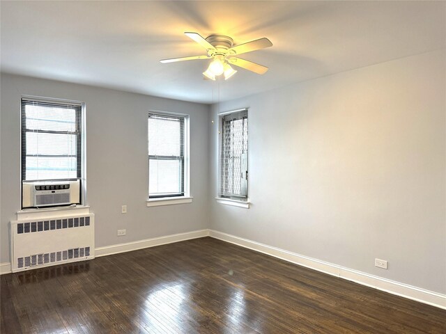 143-50 Hoover Ave Unit 204, Briarwood, NY 11435 - unfurnished room featuring radiator, a ceiling fan, cooling unit, baseboards, and dark wood-style flooring