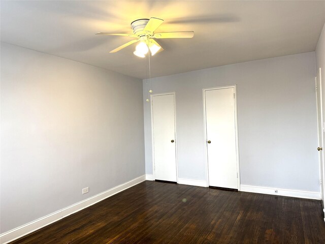 143-50 Hoover Ave Unit 204, Briarwood, NY 11435 - unfurnished bedroom with dark wood finished floors, baseboards, and ceiling fan