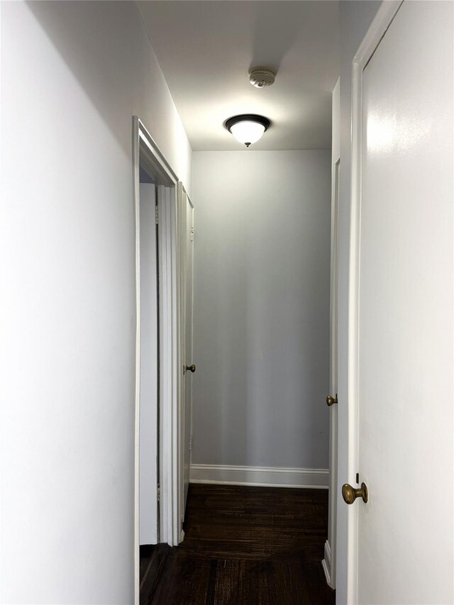 143-50 Hoover Ave Unit 204, Briarwood, NY 11435 - corridor featuring baseboards and dark wood-style flooring