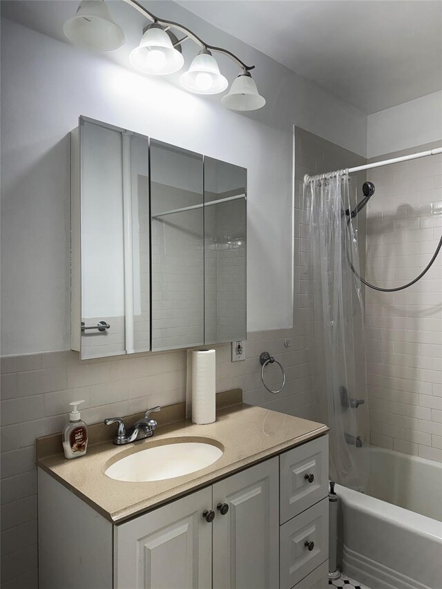 143-50 Hoover Ave Unit 204, Briarwood, NY 11435 - full bath featuring tile walls, shower / bath combo, and vanity