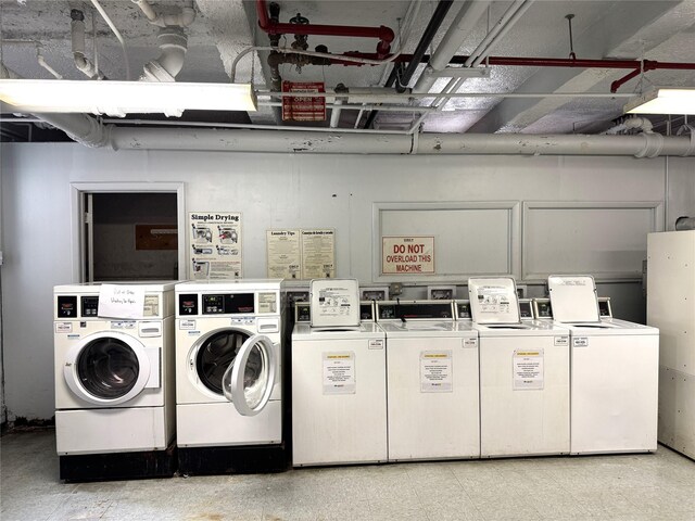 143-50 Hoover Ave Unit 204, Briarwood, NY 11435 - community laundry room featuring washing machine and dryer and light floors