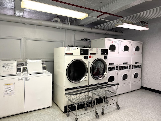 143-50 Hoover Ave Unit 204, Briarwood, NY 11435 - shared laundry area with separate washer and dryer, light floors, stacked washer and clothes dryer, and baseboards