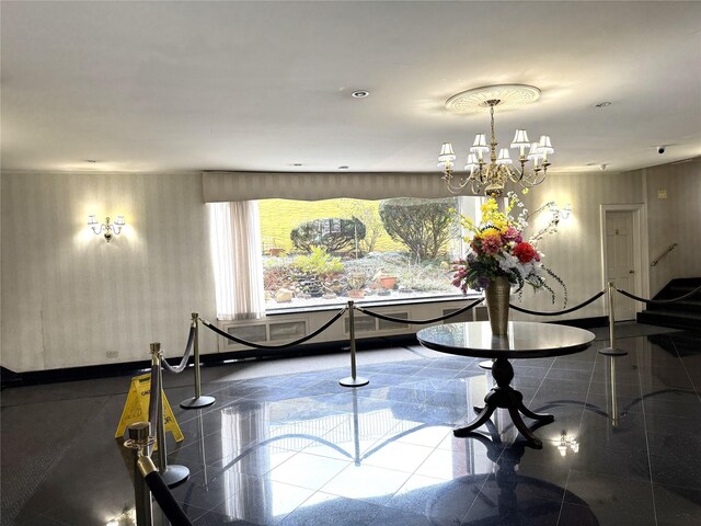 143-50 Hoover Ave Unit 204, Briarwood, NY 11435 - interior space with granite finish floor and an inviting chandelier