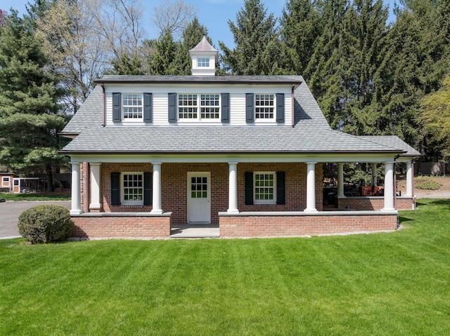 182 Taconic Rd, Greenwich, CT 06831 - view of front facade featuring brick siding, a front yard, and covered porch
