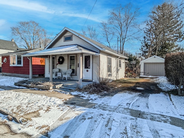 view of front facade with a storage unit and a porch