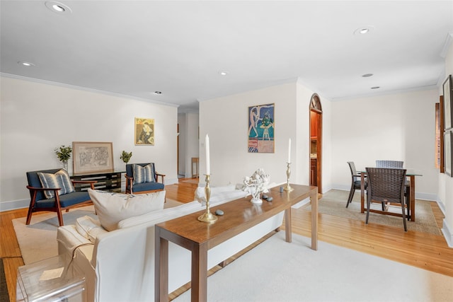 living room featuring ornamental molding and hardwood / wood-style floors