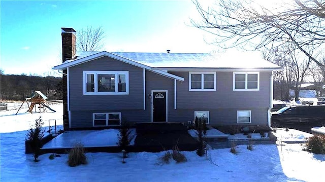 view of front of home featuring a playground