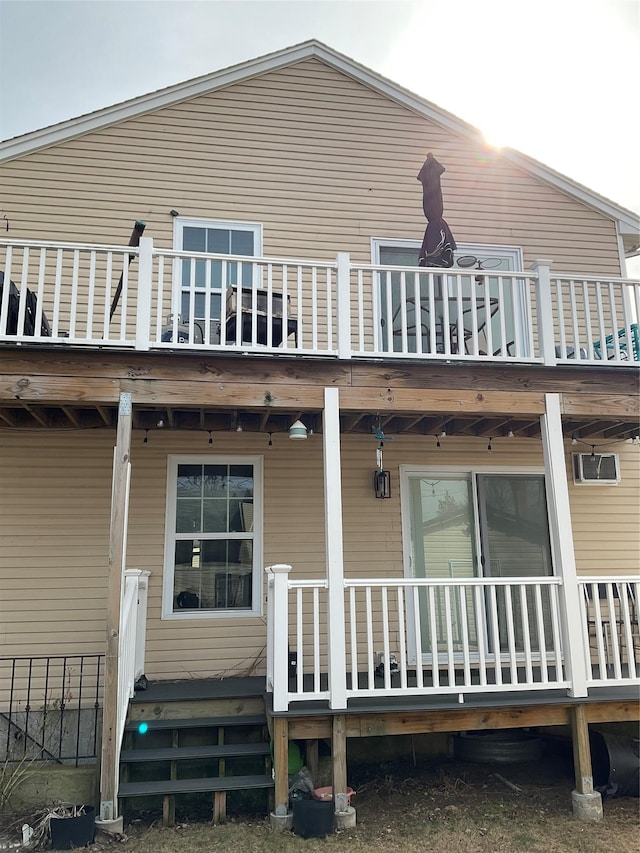 rear view of property featuring a balcony